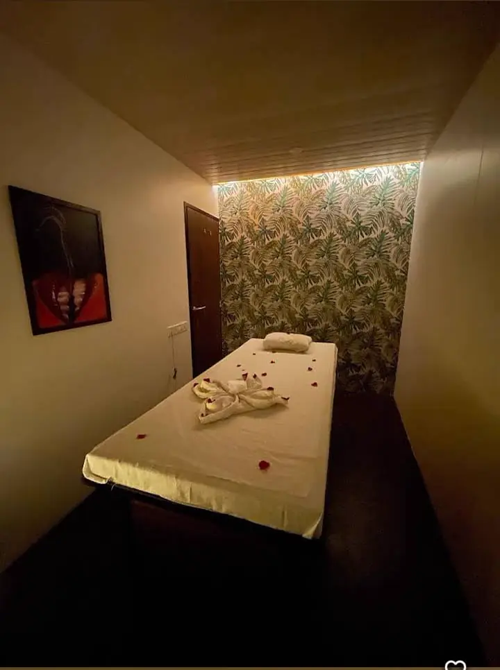 Private single massage room with warm ambient lighting